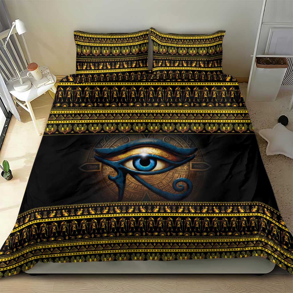 Black duvet cover featuring blue Eye of Ra and repeating gold stripe border