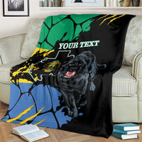Black blanket featuring panther face, map shapes in blue/green/yellow, and “YOUR TEXT”