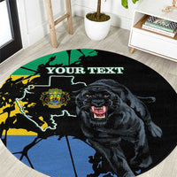 Round black rug close-up: panther and world map graphic with “YOUR TEXT” banner