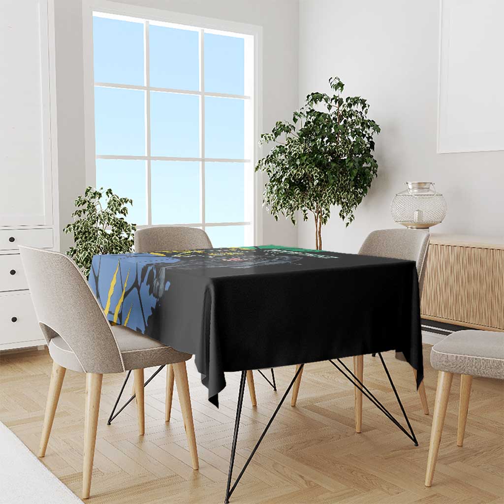 Black tablecloth with panther and map-style design, on dining table with chairs