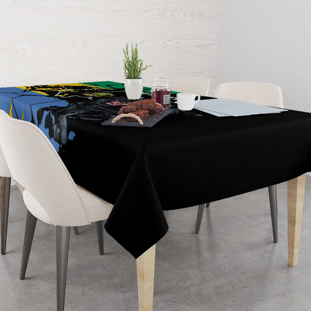 Black tablecloth with large panther and blue map-style graphic, draped on dining table