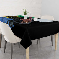 Black tablecloth with large panther and blue map-style graphic, draped on dining table