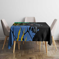 Black tablecloth with blue-yellow panther artwork, spread over square dining table
