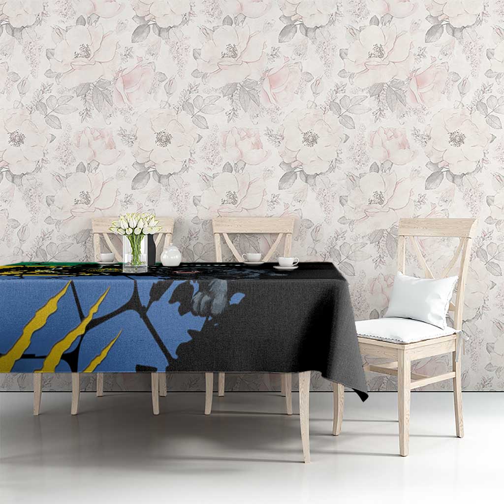 Black and blue tablecloth featuring panther and map-style print, on dining set