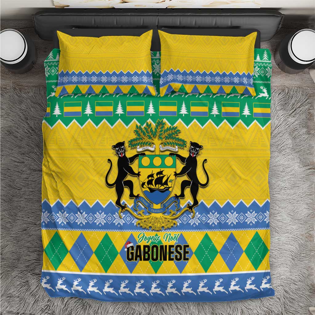 Yellow duvet with green and blue holiday pattern, crest and “GABONESE” text, two pillows.