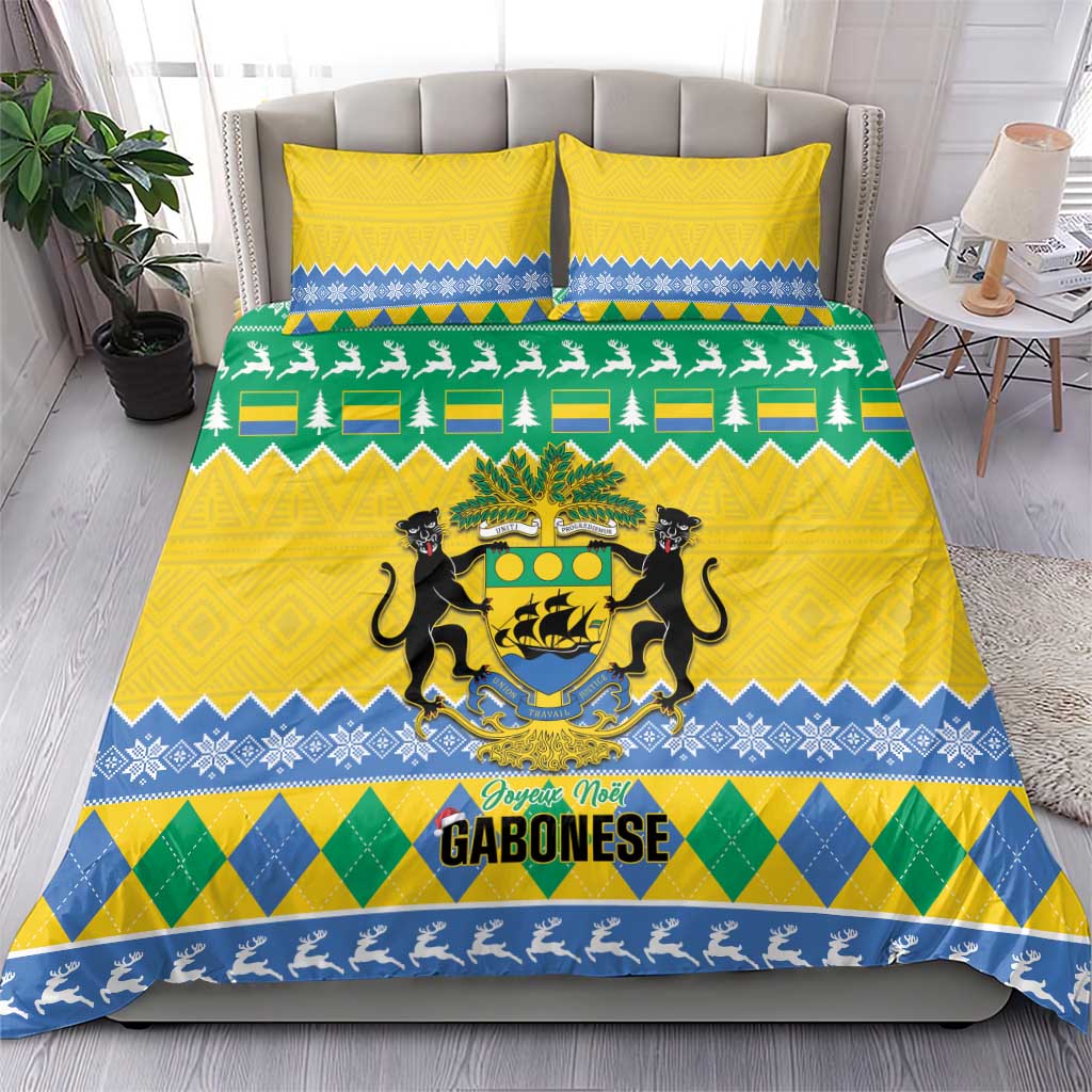 Yellow Christmas bedding with green trees, blue shapes, and Gabon coat of arms graphic.