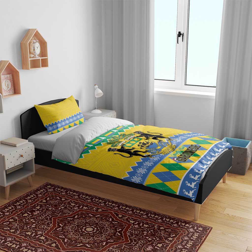 Yellow, green, and blue printed duvet with Gabon crest on bed with matching pillows.