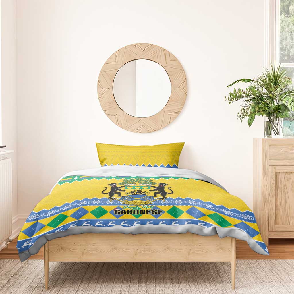 Yellow, blue, and green Christmas bedding set with Gabon coat of arms on duvet.