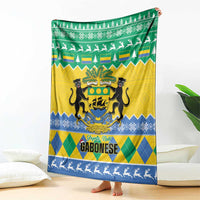 Green, yellow and blue Christmas blanket with coat of arms and reindeer silhouettes