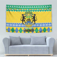 Gabon Christmas tapestry with large coat-of-arms crest and holiday border of trees and icons