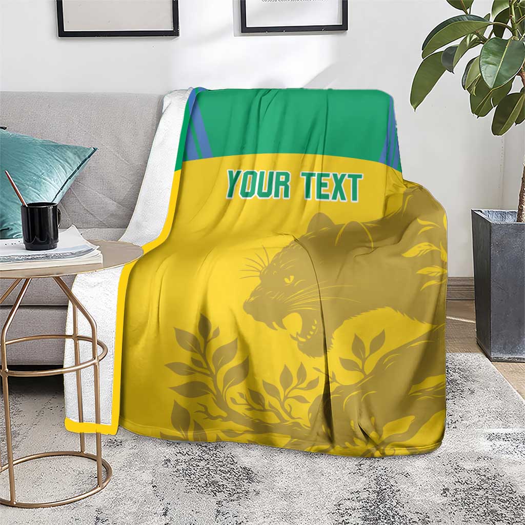 Yellow and green football blanket featuring custom text and large animal silhouette artwork