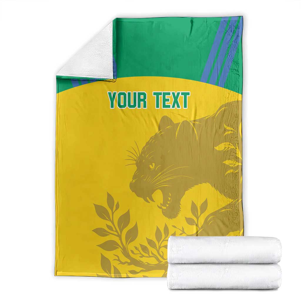 Folded yellow and green football blanket set with custom text and animal-and-leaf graphic