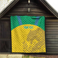 Custom football quilt blanket with green top, yellow bottom, and “YOUR TEXT” in the middle