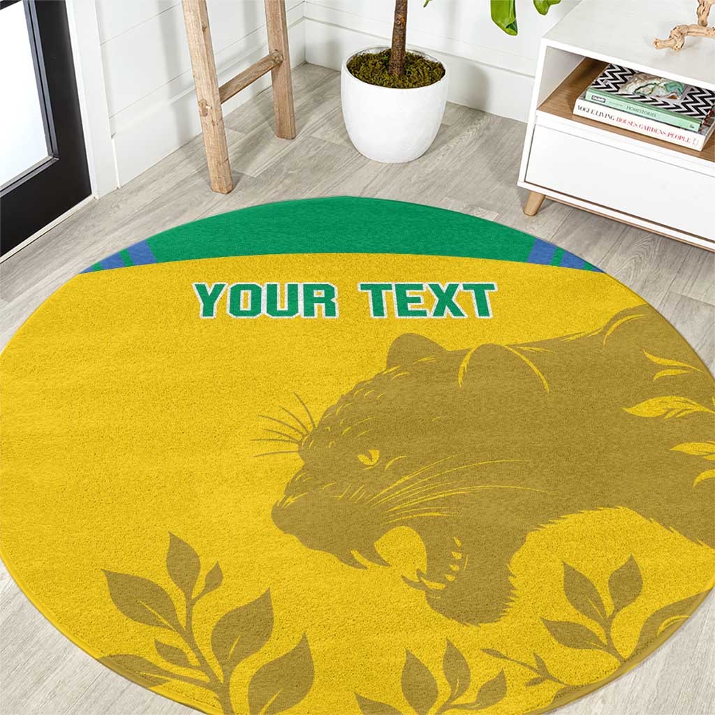 Yellow round carpet with green rim and lion silhouette with leaf pattern; bold blue text.
