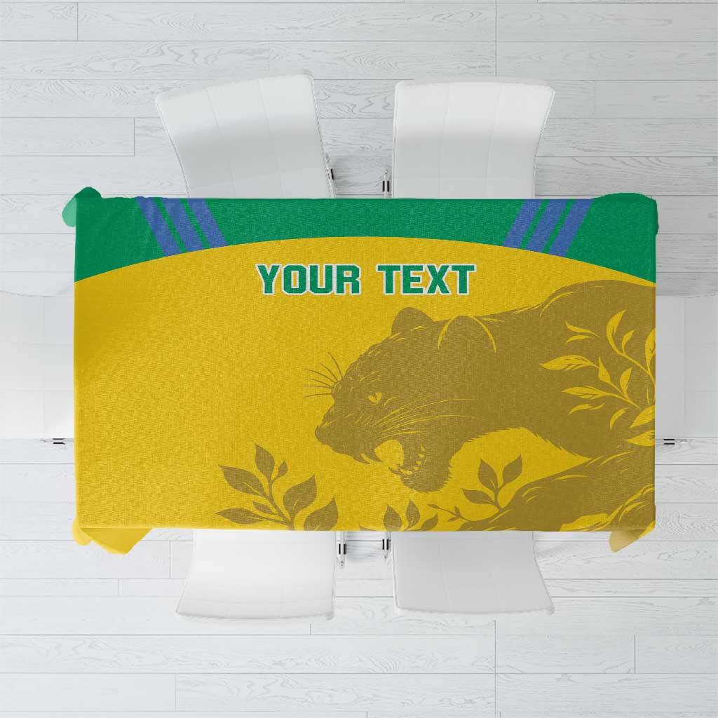 Yellow football tablecloth with green border, gold animal and leaf pattern