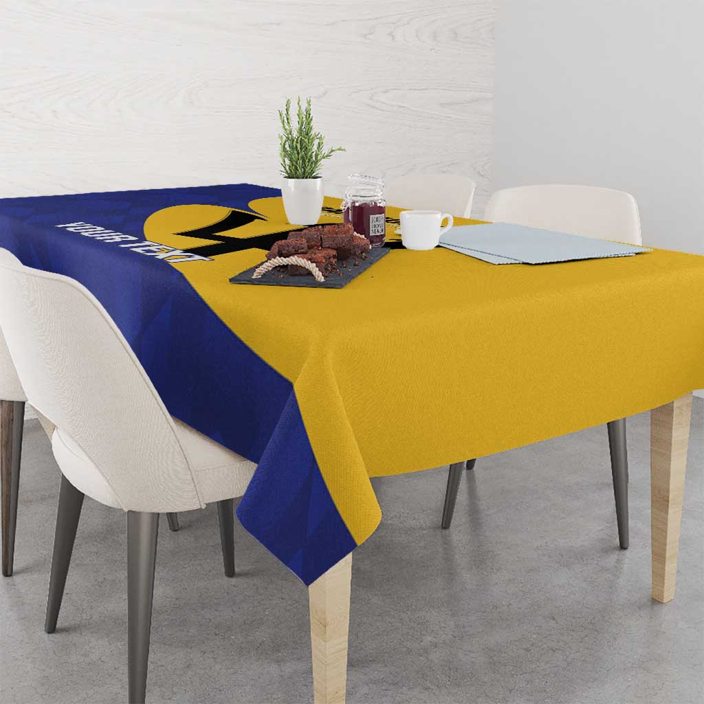 Football tablecloth in blue and yellow with Barbados logo, table setup with cups and decor