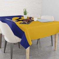 Football tablecloth in blue and yellow with Barbados logo, table setup with cups and decor