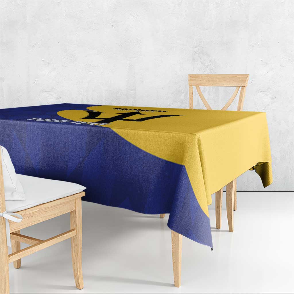Blue and yellow football tablecloth with Barbados graphic, corner view on wooden dining bench