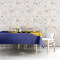 Blue and yellow football tablecloth with Barbados graphic, on dining table with four chairs