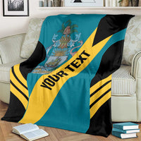 Teal football blanket draped on couch with yellow diagonal stripe and crest emblem