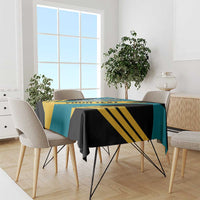 Football tablecloth draped on a dining table; aquamarine, black, and yellow stripe design.