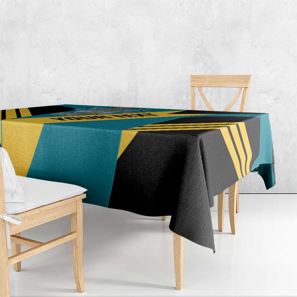 Aquamarine football tablecloth with black and yellow diagonal panels and hanging corner.