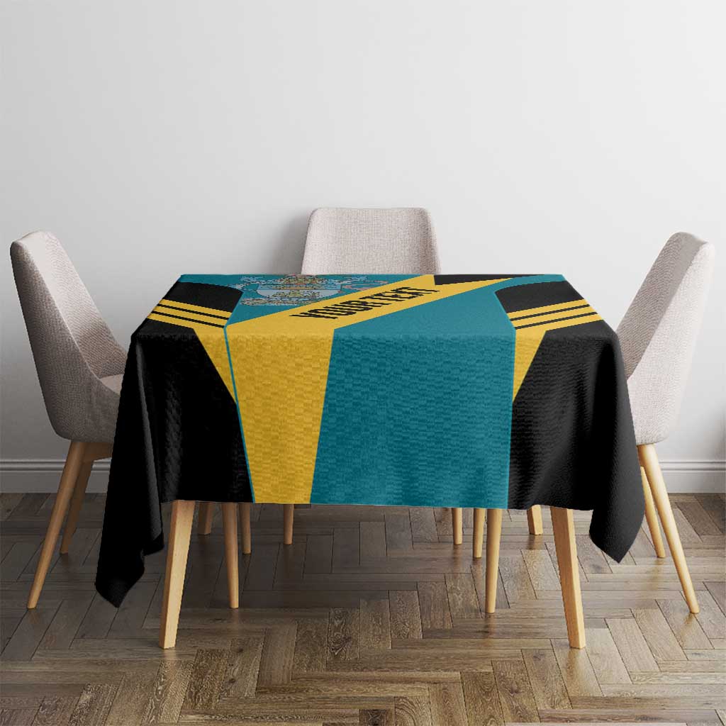 Square football tablecloth on dining table; aquamarine, black, and yellow geometric stripes.