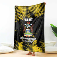 Custom football blanket in black and yellow with Antigua crest and “YOUR TEXT” print