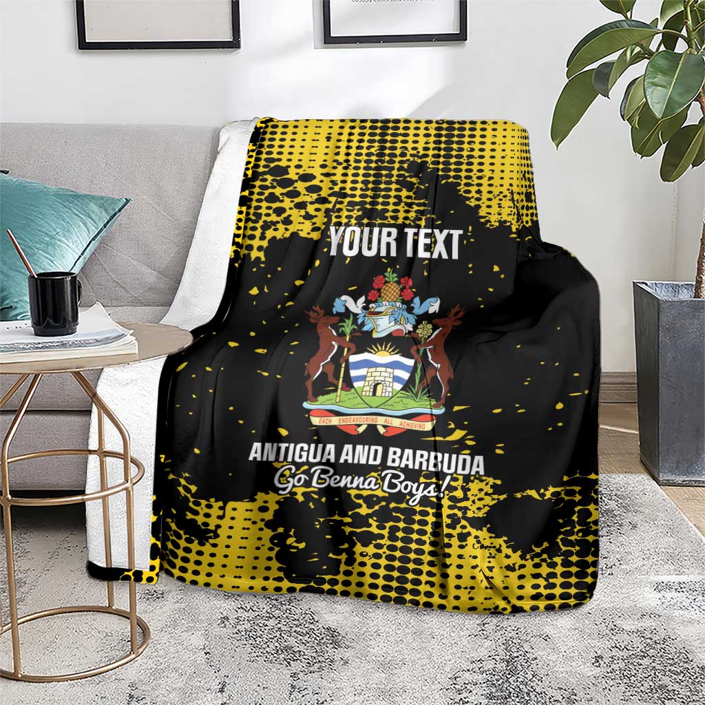 Football blanket in black and yellow, draped over an armchair with Antigua crest and text