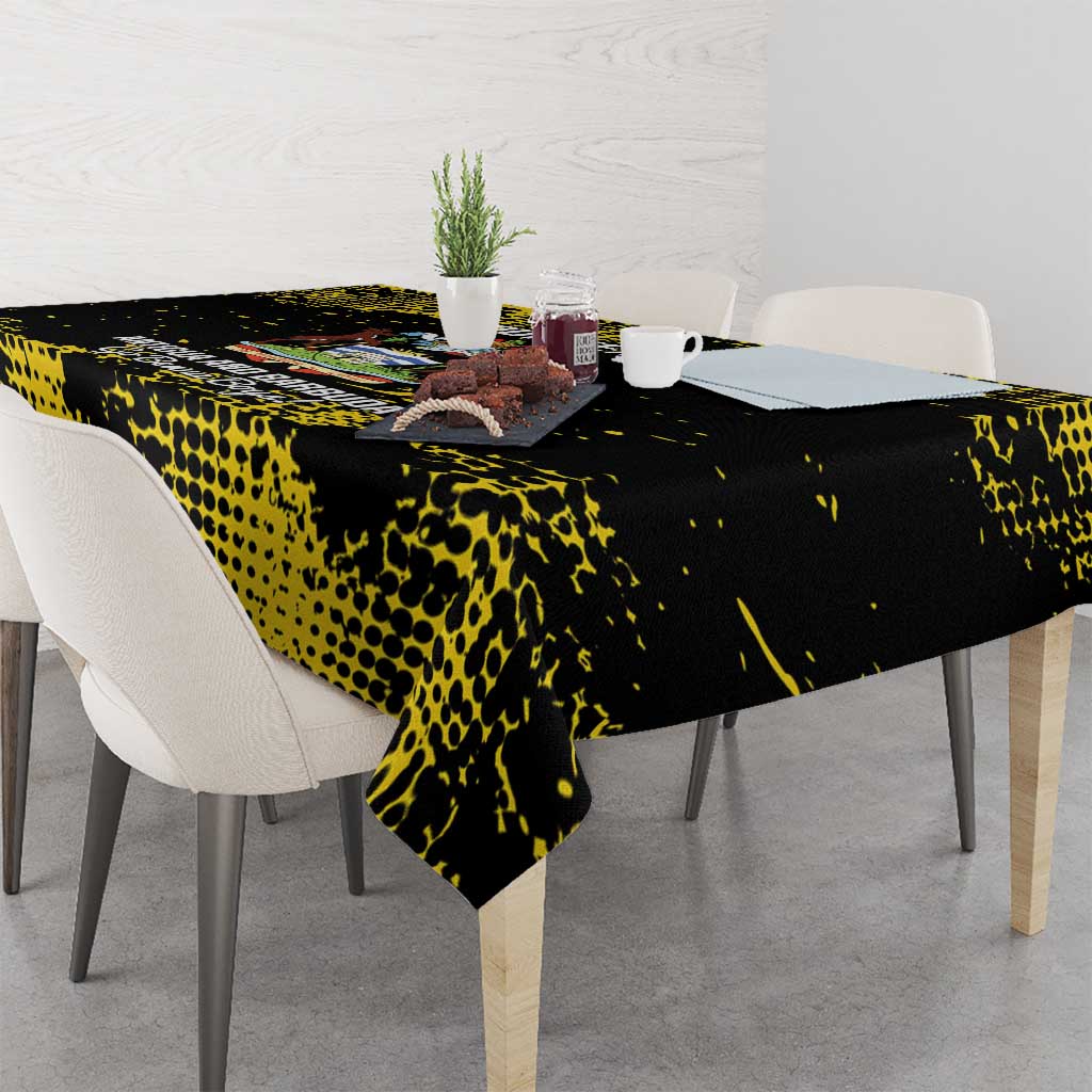 Black tablecloth with yellow speckled pattern, corner overhang on dining table