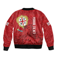 Red bomber jacket back with Sardinia crest, mountain-style graphic and black ribbed hem