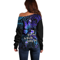 Off-shoulder sweater, black with teal-blue and purple butterfly back graphic and 'Your life' text