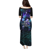 Maxi-length long dress with black base, teal and purple floral Polynesian pattern, back print