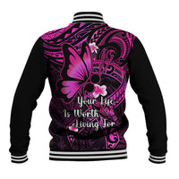 Unisex varsity baseball jacket back view, black with pink floral Polynesian pattern and Your life