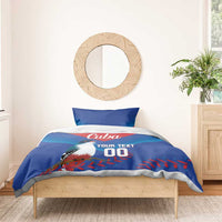 Blue and red bedding set with bird graphic, Cuba text, 'YOUR TEXT', and '00' on bed