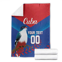 Folded Cuba-themed blue and red blanket with white bird, 'Cuba' and 'Your Text' 00.