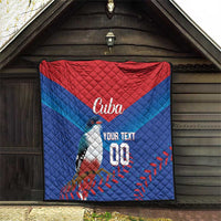 Blue and red Cuba quilt blanket hanging indoors, bird graphic with 'Cuba' and 'YOUR TEXT 00'
