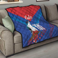 Blue and red Cuba quilt blanket on gray sofa with bird graphic, 'Cuba' and 'YOUR TEXT'