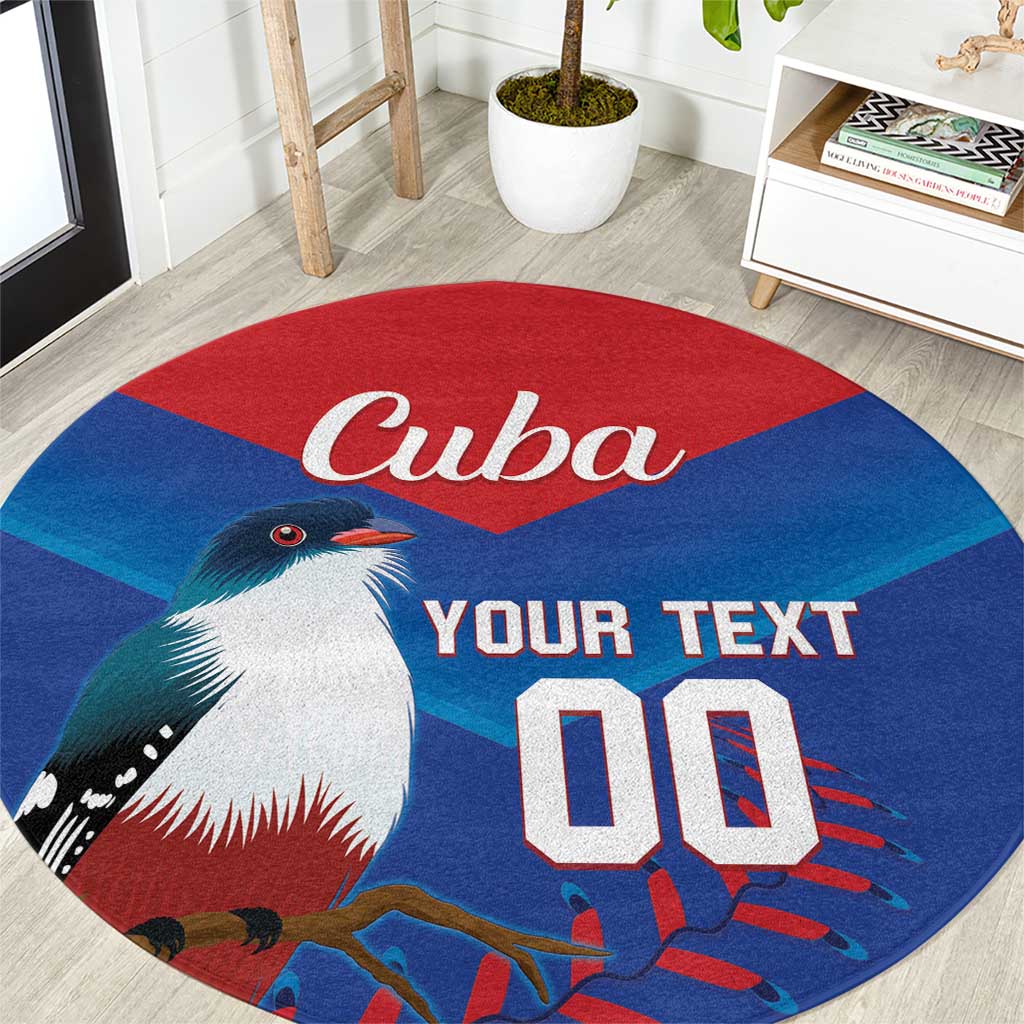 Round blue rug with Cuba word, bird graphic, and custom YOUR TEXT lettering.