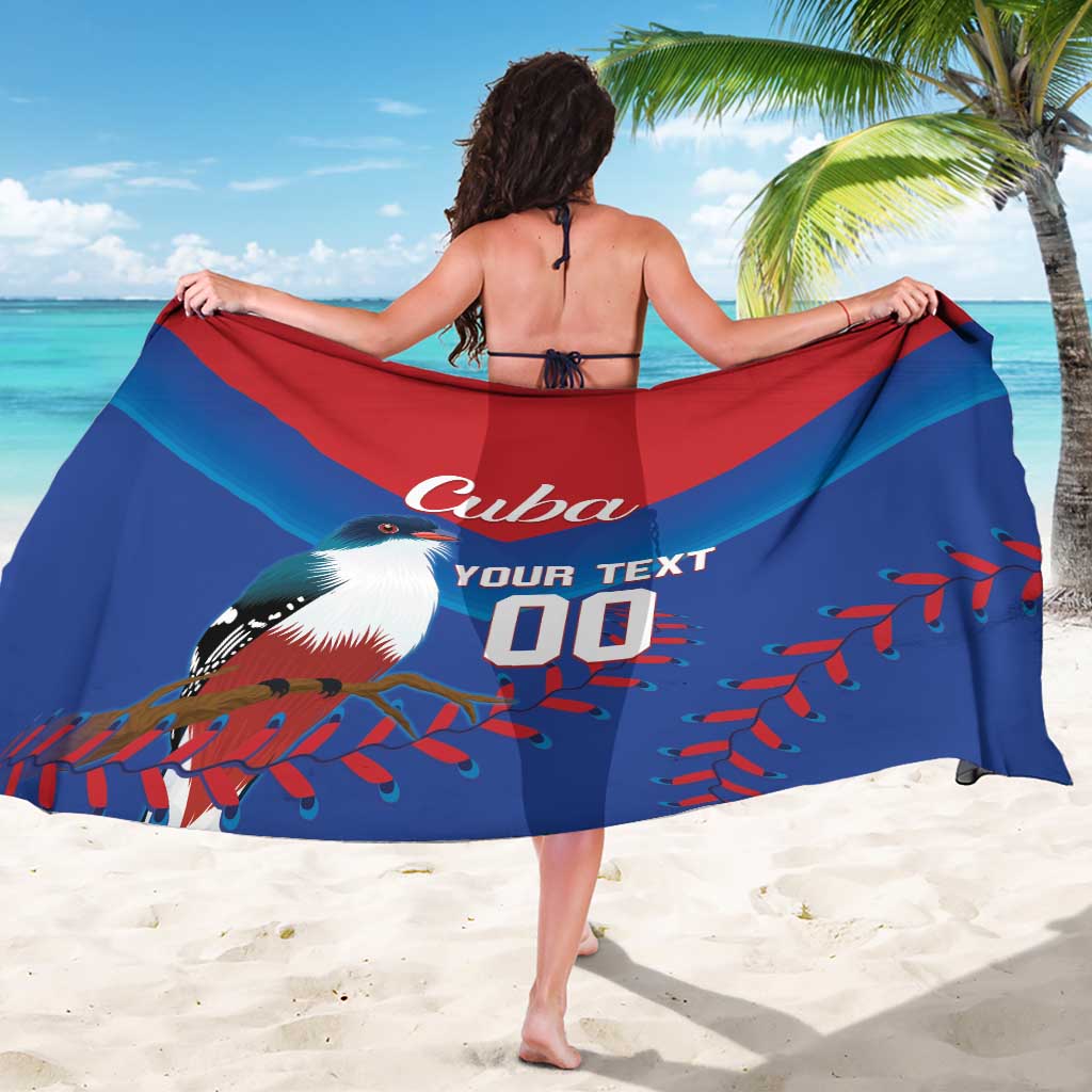 Blue and red printed beach sarong draped around shoulders with Cuba and number 00