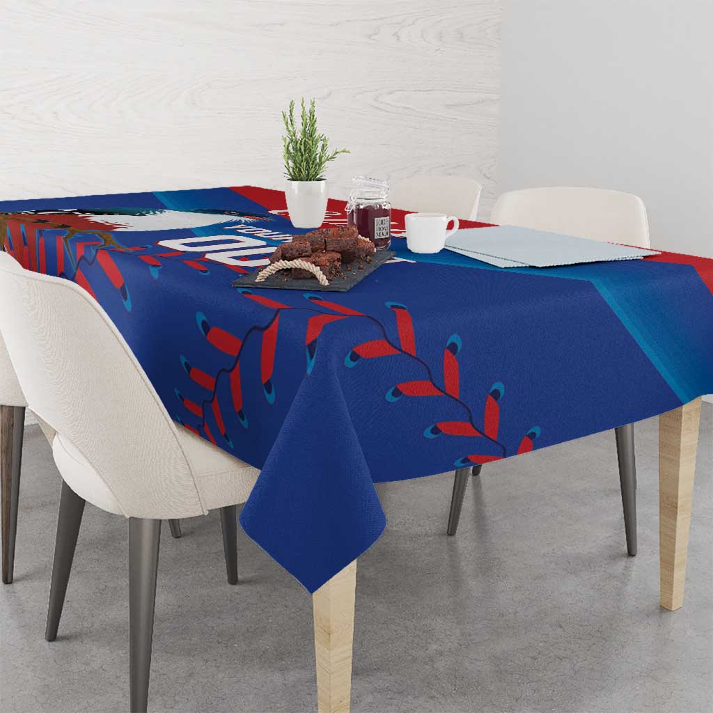 Blue tablecloth with red and teal leaf-like motif, draped across a dining table