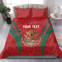 Red bedding set with green rays, Aztec symbols, two pillow shams, eagle and text