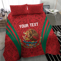 Red duvet and pillow shams with green rays and Aztec pattern, eagle center print