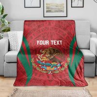 Custom blanket draped on sofa: red Aztec pattern with green stripes and eagle graphic