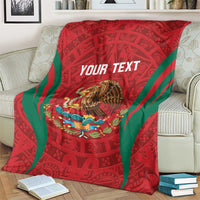 Custom blanket on couch: red Aztec print with green stripes and large eagle image