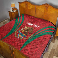 Red quilt blanket with green diagonal stripes, Mexico crest and 'YOUR TEXT' on bed