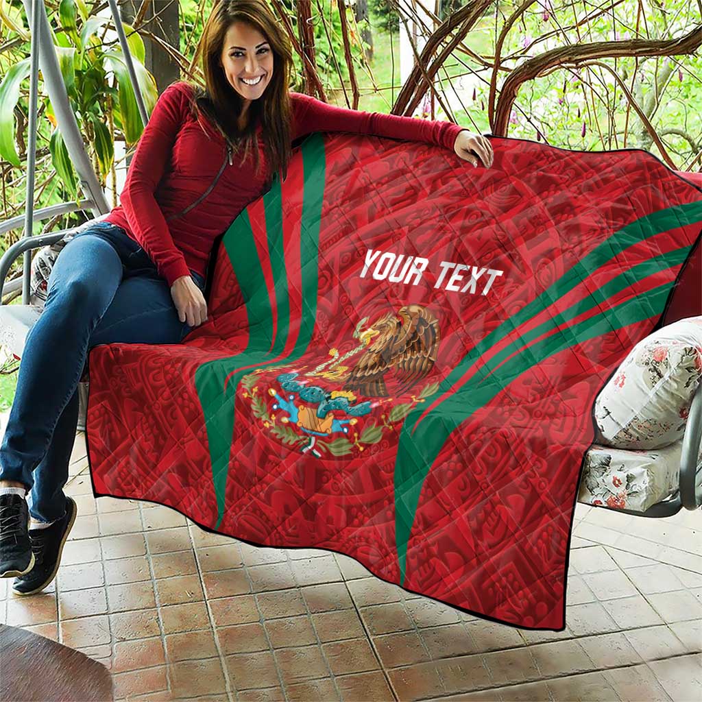 Red quilt blanket draped over couch with green diagonal stripes, Mexico crest and 'YOUR TEXT'
