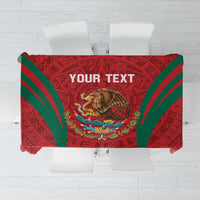Custom tablecloth with red Aztec-style calendar pattern and green diagonal stripes