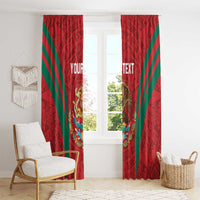 Red window curtain panels with green diagonal stripes and eagle-lion Aztec motif