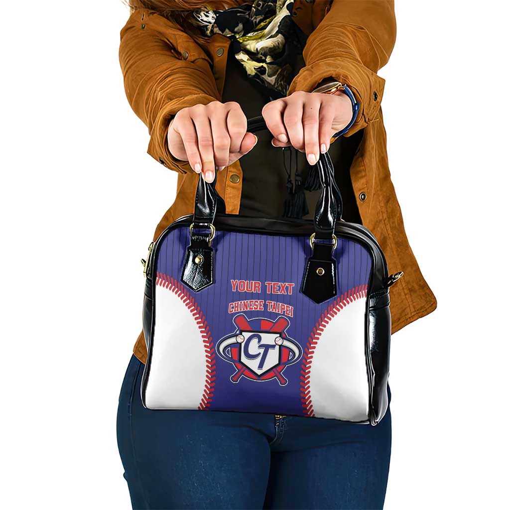 Blue, white and black baseball-style shoulder handbag with short handles and front emblem.